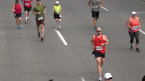 Straggler runners in a marathon Stock Footage 139977446