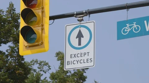 Straight ahead only except bicycles sign Stock Footage 103347707