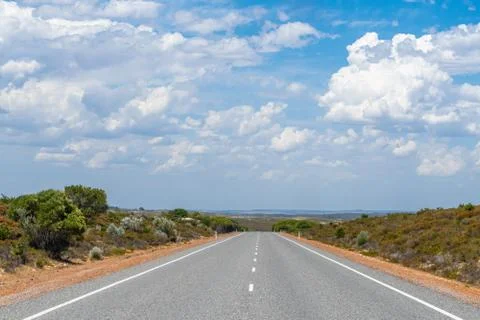 Straight and empty road close to The Pinnacles Desert in Western Australia Stock Photos