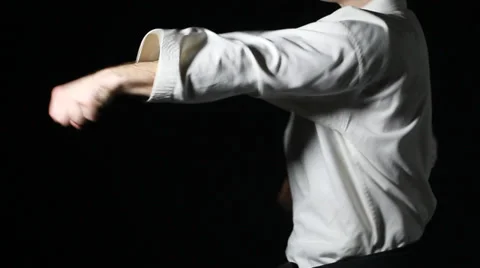 Straight blows hands are beating a sportsman in white kimono Stock Footage 35219193