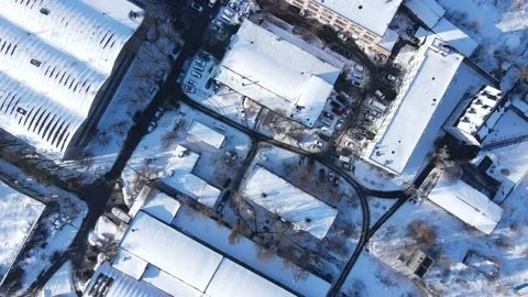 Straight down birds eye view from drone on city in winter time. Snow on top. Stock Footage 169604688