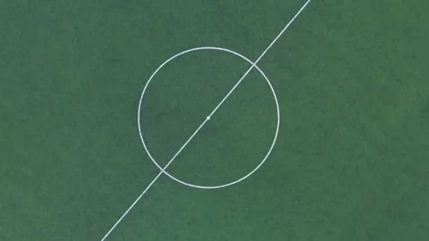 Straight-down drone view centered on the midfield circle and kickoff spot of an 스톡 동영상 346311044