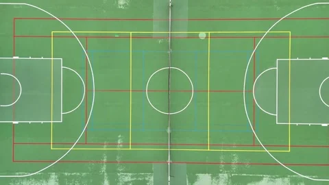 Straight-down drone view of a green multipurpose sports court with overlapping Stock Footage 347195259