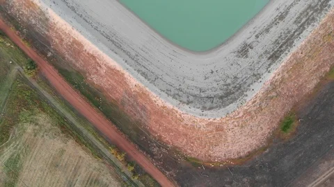 Straight down shot over dam and agrcultural land 動画素材 126343922