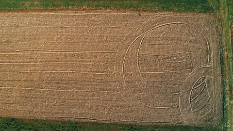 Straight down view on a field ploughed for seeding, drone flies along brown soil Stock Footage 124030229