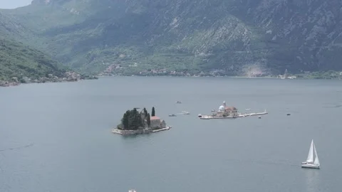 Straight Drone Pass Over Our Lady of the Rocks and Saint George Islands in Bay o Stock-Footage 310335431