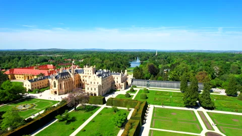Straight flight through park and over castle Lednice Chateau Stock Footage 194683024