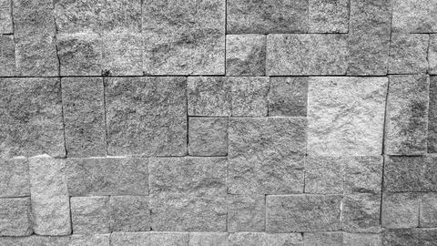 A straight horizontal monochrome front view captures a highly textured ston.. Stock Photos