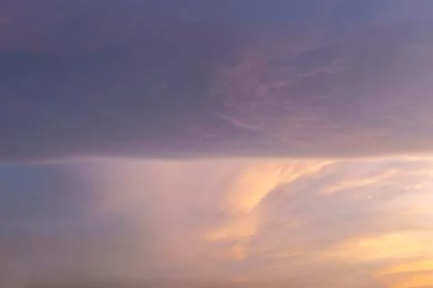 Straight line cloud spliting the sky Stock Photos
