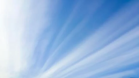 Straight line clouds as sun rays Stock Photos
