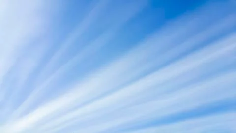 Straight line clouds as sun rays Stock Photos