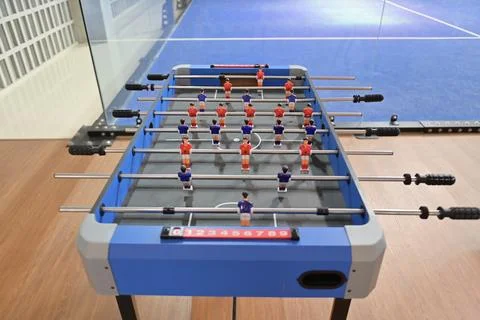 Straight-on overhead perspective of the foosball table showing all player r.. Stock Photos