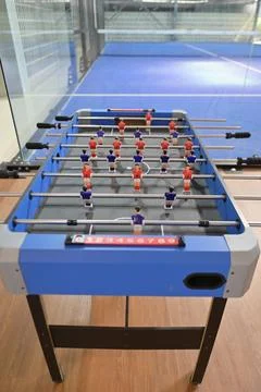 Straight-on overhead perspective of the foosball table showing all player r.. Stock Photos