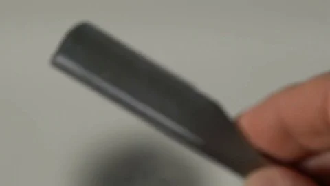 Straight razor on white Stock Footage 74448672