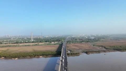 Straight road bridge over river connecting rural in Surat aerial view Stock Footage 332670798