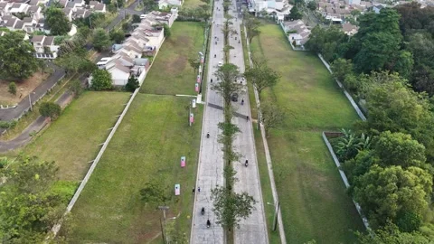 Straight Road with Green Fields and Housing Aerial View Vídeos de archivo 340633752