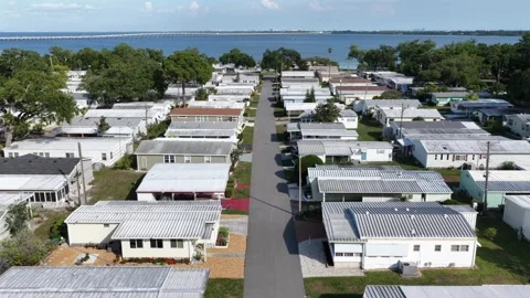 Straight street cuts through mobile home park in Clearwater, Florida, USA Stock Footage 339908613