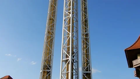 Straight Vertical Shooting Tower Roller Coaster Ride On Clear Blue Sunshine Day Stock Footage 225577517
