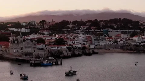 Straight up view of Cascais Bay towards Sintra mountains with fog at sunset Stock Footage 201896212