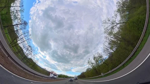 Straight UP View to Sky and Clouds During Long British Road Travel Stock Footage 333709386