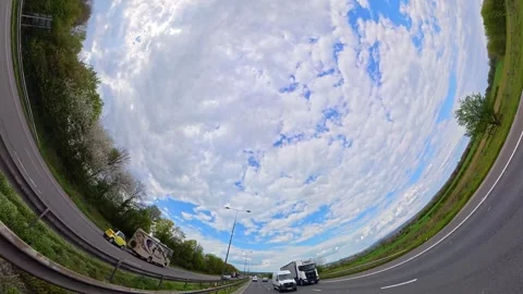 Straight UP View to Sky and Clouds During Long UK Road Travel Stock Footage 333716483