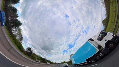 Straight UP View to Sky and Clouds During Long UK Road Travel Stock Footage 333717218