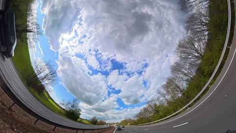 Straight UP View to Sky and Clouds During Long UK Road Travel Stock Footage 333750628