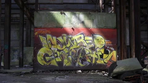 Straight View Of A Sunlit Wall With A Graffiti Stock Footage 130897319