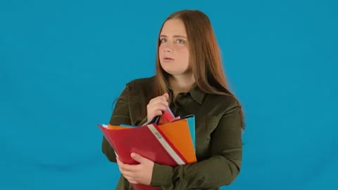 Strained female worker counts folders realizing magnitude of work Stock Footage 316084353