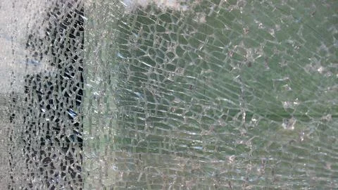 Strained glass broken window from explosion splinter. Shattered glass. Abstra Stock Photos