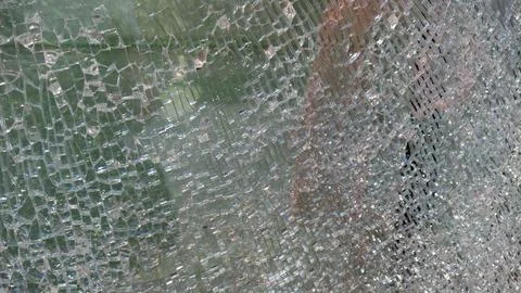 Strained glass broken window from explosion splinter. Shattered glass. Abstra Stock Photos
