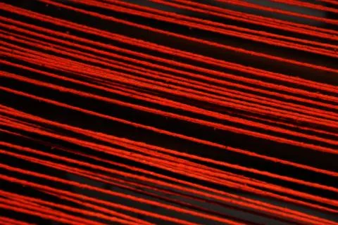 Strained thic red threads Foto stock