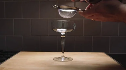 Straining a cocktail in slow motion Stock Footage 84900411