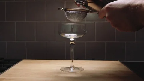 Straining a cocktail in slow motion Stock Footage 84900466