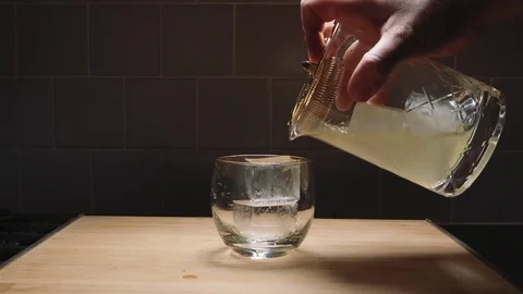 Straining a cocktail in slow motion Stock Footage 84900537