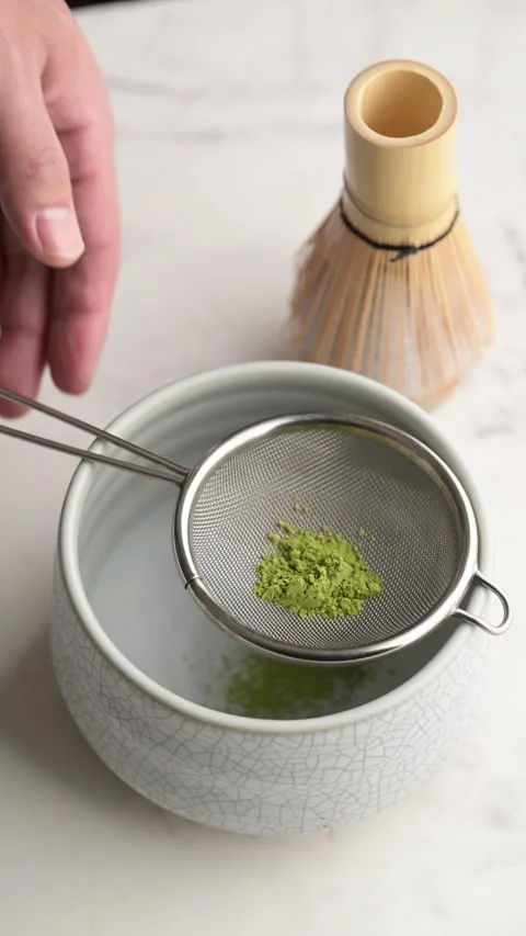 Straining matcha to fine powder Stock Footage 270795471