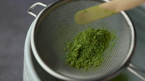 Straining matcha powder with strainer	 Stock Footage 158320799