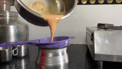 Straining Tea with Sieve Stock Footage 315625065