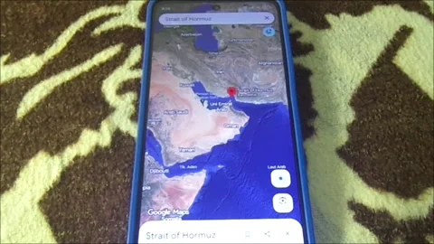 Strait of Hormuz Map on Smartphone Global Shipping Crisis 2026 Stock Footage 330981426