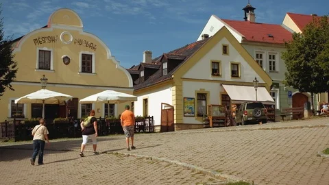 Stramberk - People walking on square surrounded by historic buildings. 4K Stock Footage 115149990
