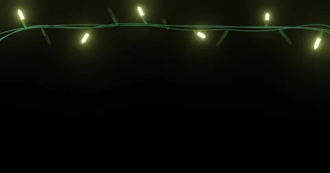 Strand of yellow christmas string lights flashing on black background, copy Stock Footage 253158425
