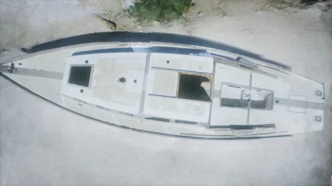 Stranded abandonned boat on the beach Stock Footage 141650896