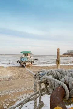Stranded boat_Low tide Stock Photos