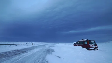 Stranded car on road after snow storm Iceland winter Stock Footage 102517656
