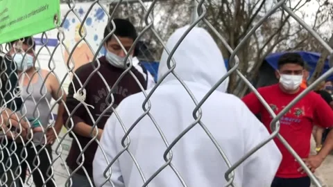 Stranded migrants in Mexico cross border to US from three different points, Ciud Stock Footage 203999469