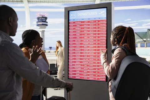 Stranded people react to bad news of cancelled flights and suspended departures Stock Photos