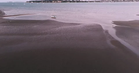 Stranded sailboat on beach Stock Footage 219206936