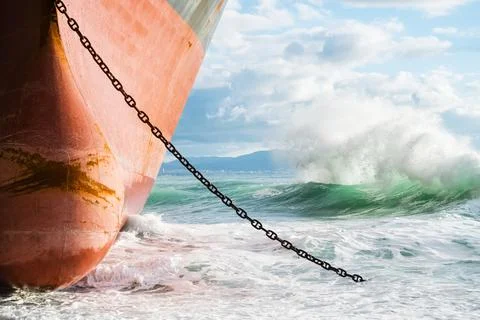 Stranded ship on the shore. Waves are hitting the ship side by side. Stock Photos