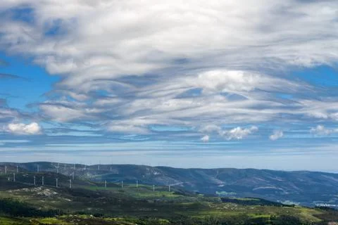 Strange cloud formations over a wind farm Foto stock