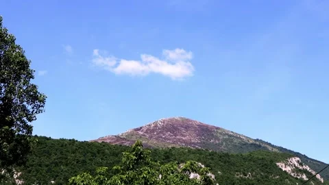 Strange clouds above the magical mountain Stock Footage 311381630